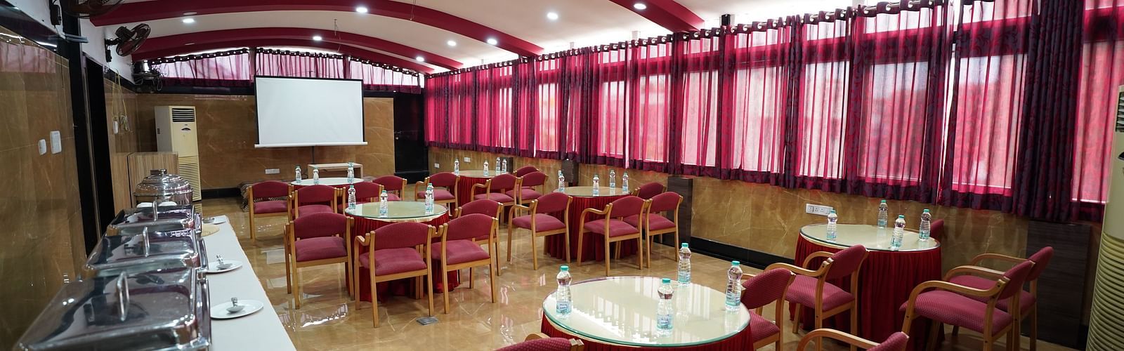 an image of an event hall with buffet arranged close to the wall at  City Centre Residency, Bangalore