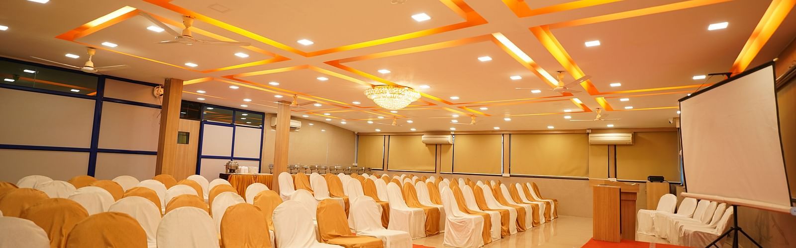 an image of a event space with chairs arranged for a function at  City Centre Residency, Bangalore