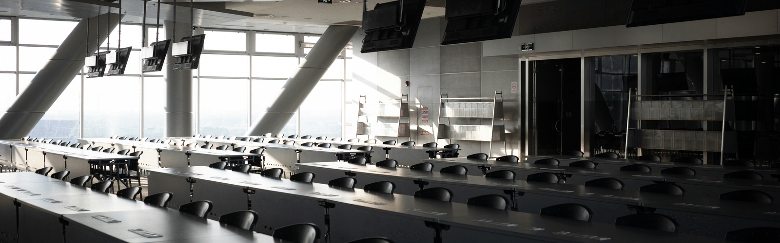 A view of a meeting room inside a building with many chairs and long tables in view inside Queen Sirikit National Convention Center, Bangkok.