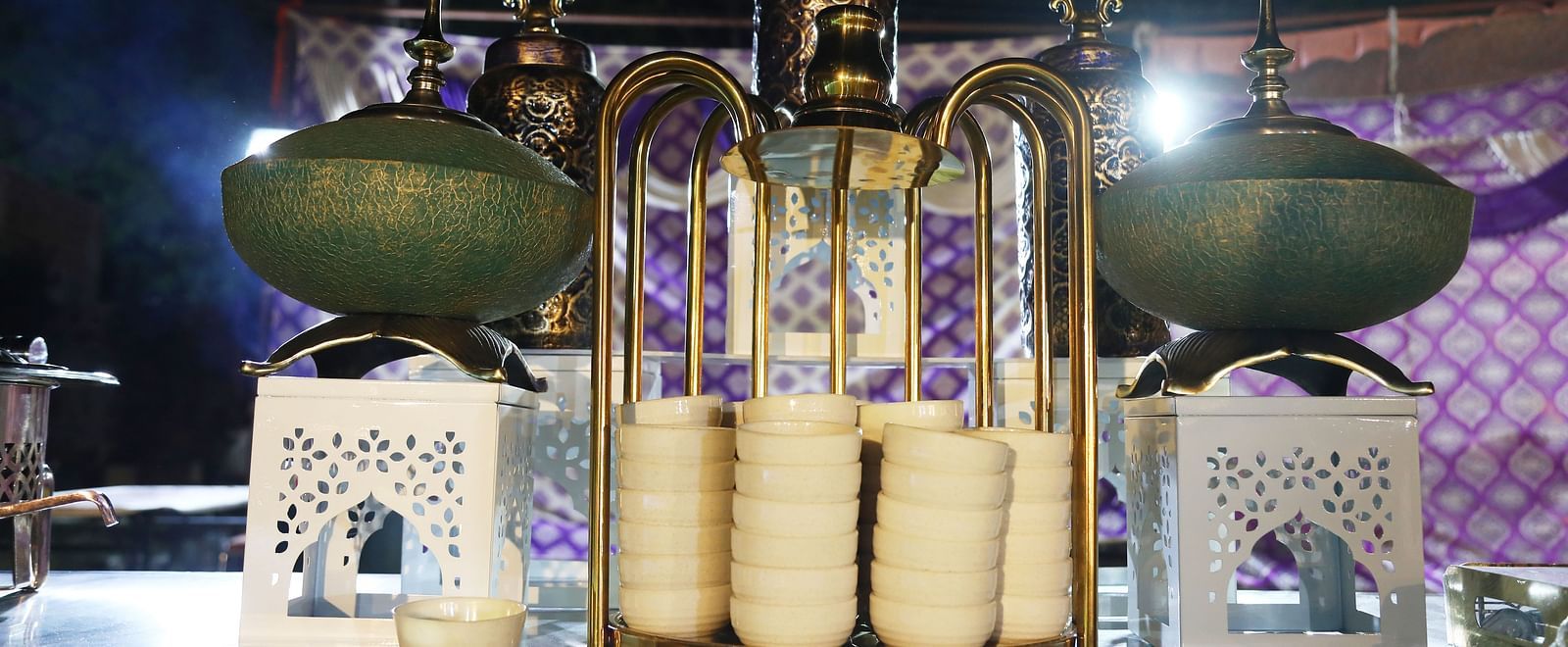Beverage setup with traditional containers and ceramic dispensers at Tisya Farms, Gurgaon.