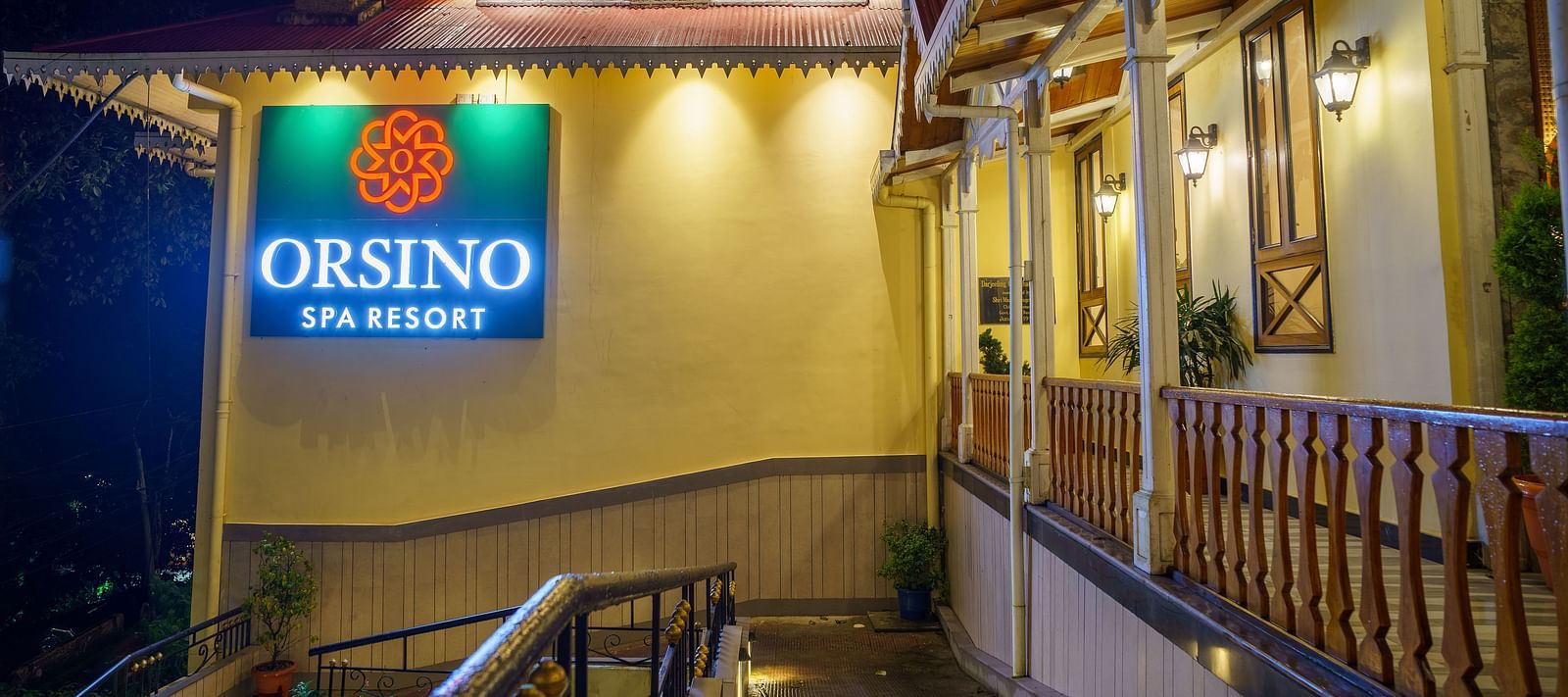 The exterior of Orsino Spa Resort with warm lighting and visible architectural details.