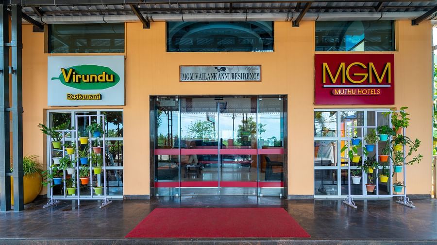 Entrance of MGM Vailankanni Residency building through the glass doors