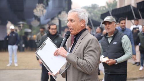 An image of an senior citizen giving a speech on golf course for the game day - Heritage Village Resorts & Spa
