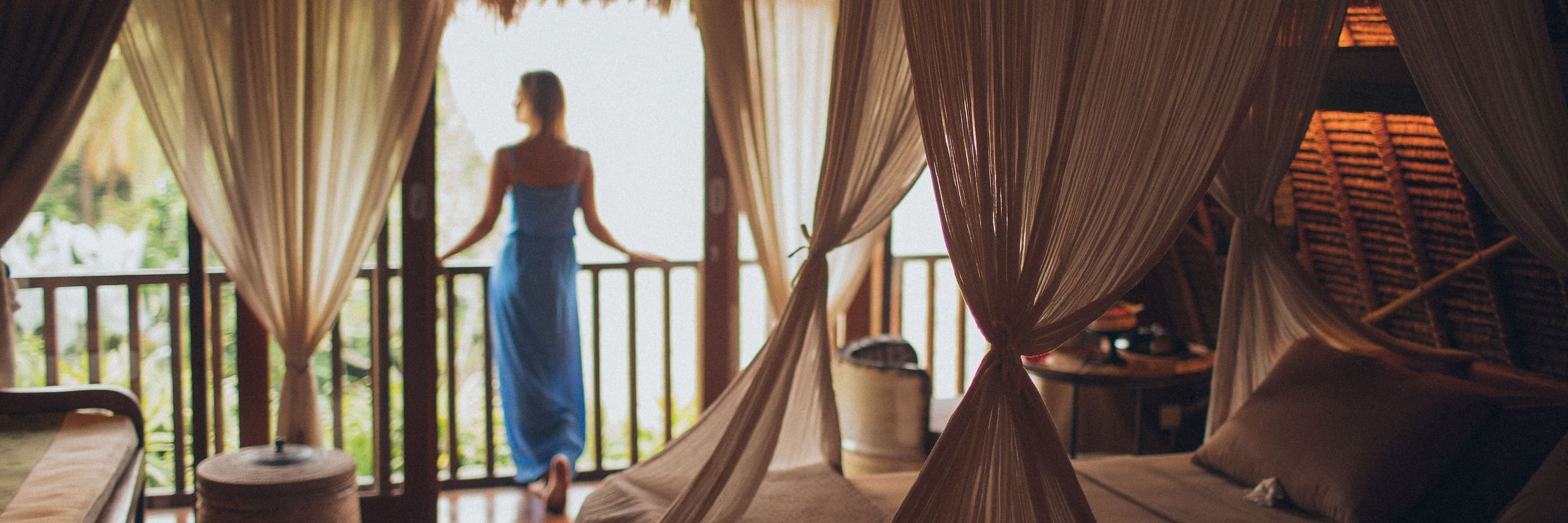 woman looking outside the balcony