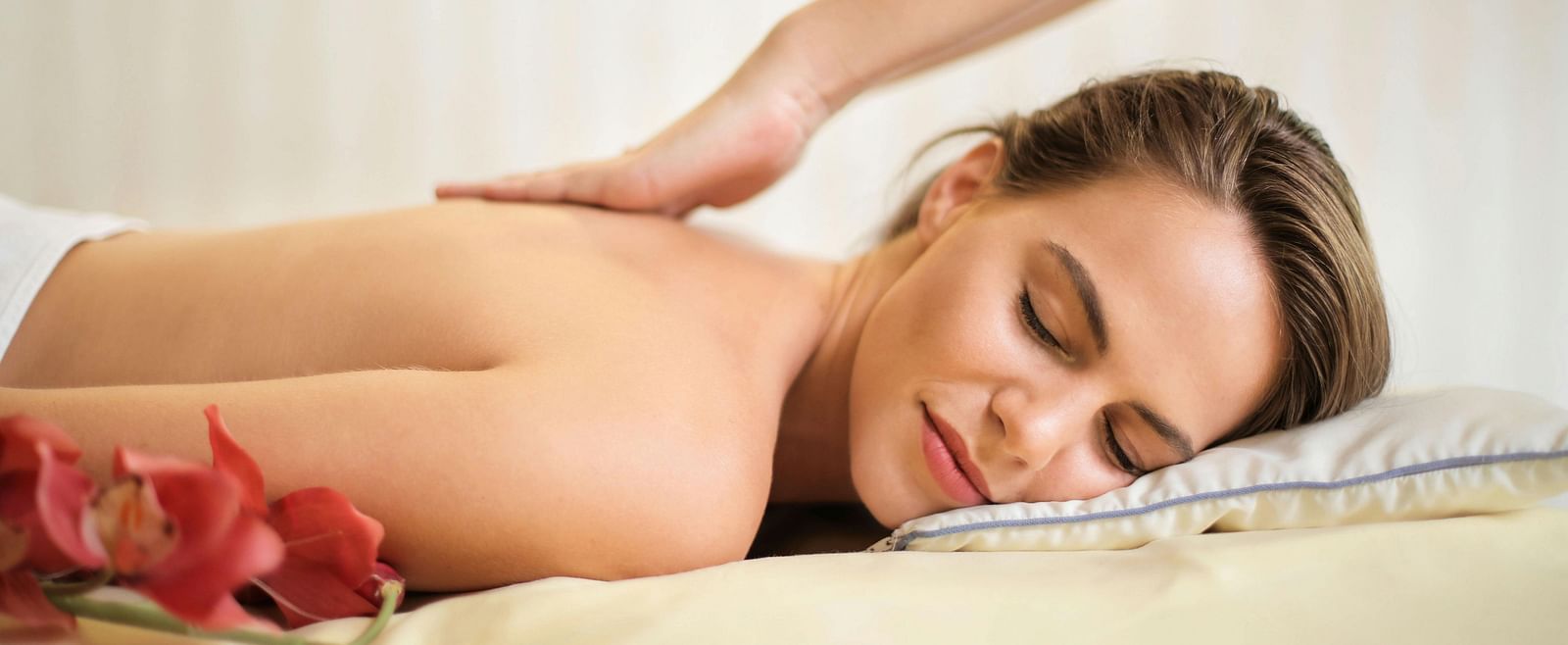 A person receiving a back massage.