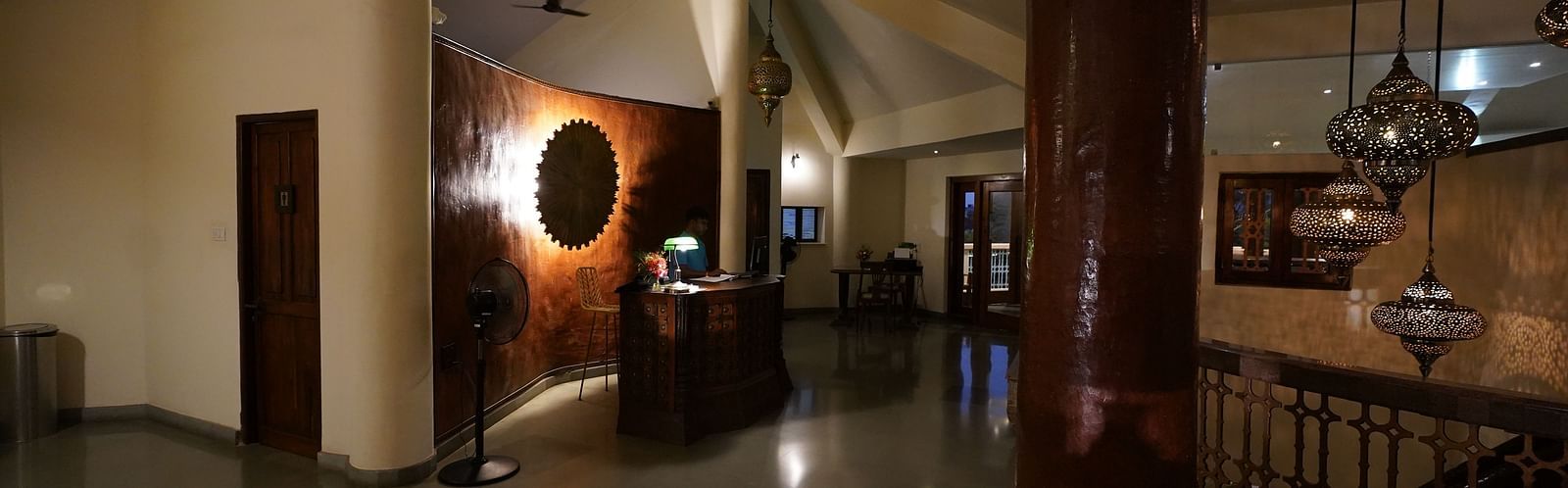 An image of a reception with dim lighting and bespoke decors - Argo by Trance, Goa
