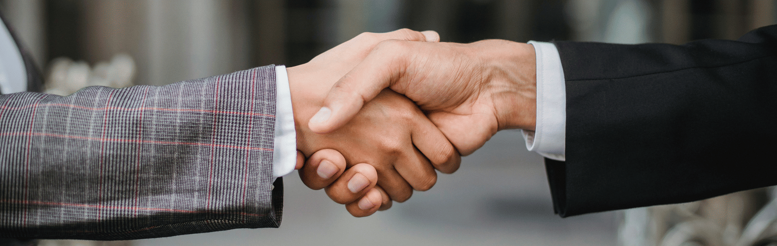 An image of two people shaking hands