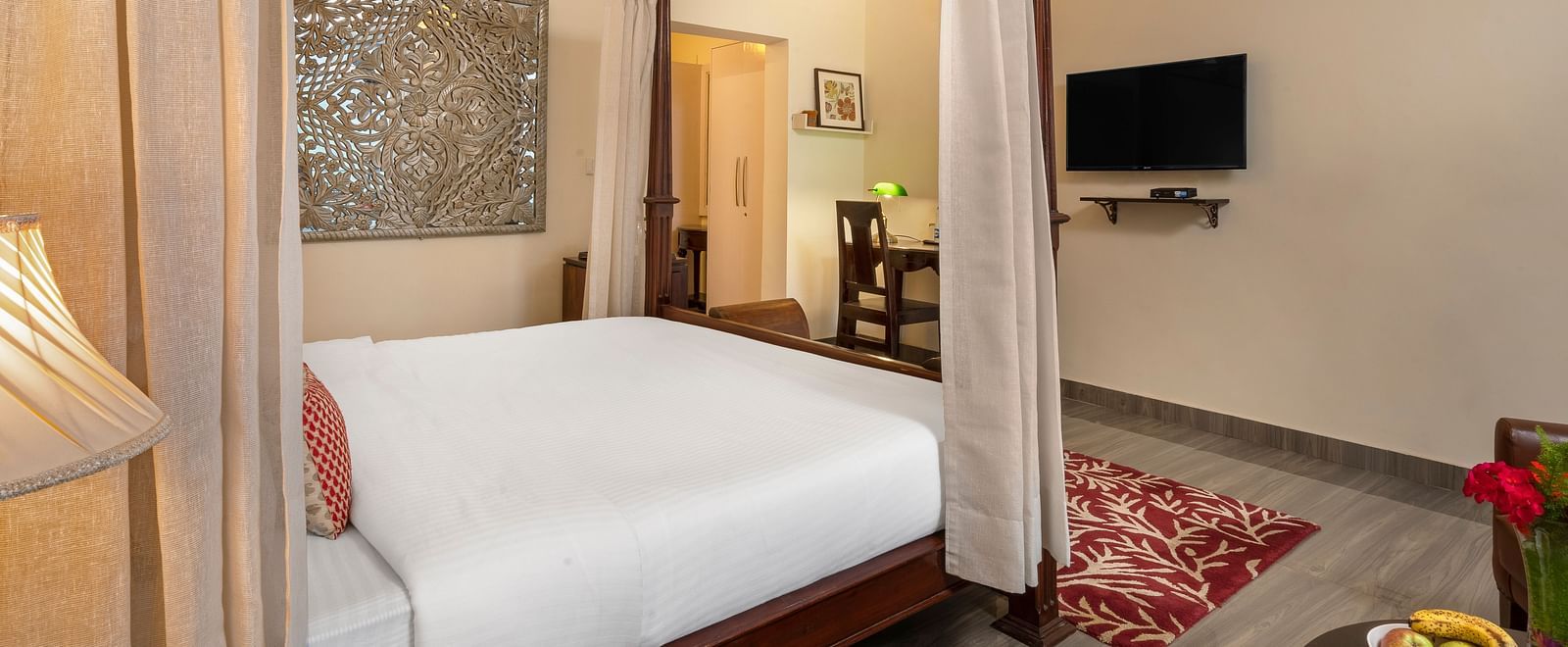 Comfortable suite with elegant furnishings, canopy bed, and flat-screen TV, at BluSalzz Collection - Suvaasa Resort, Ramgarh.
