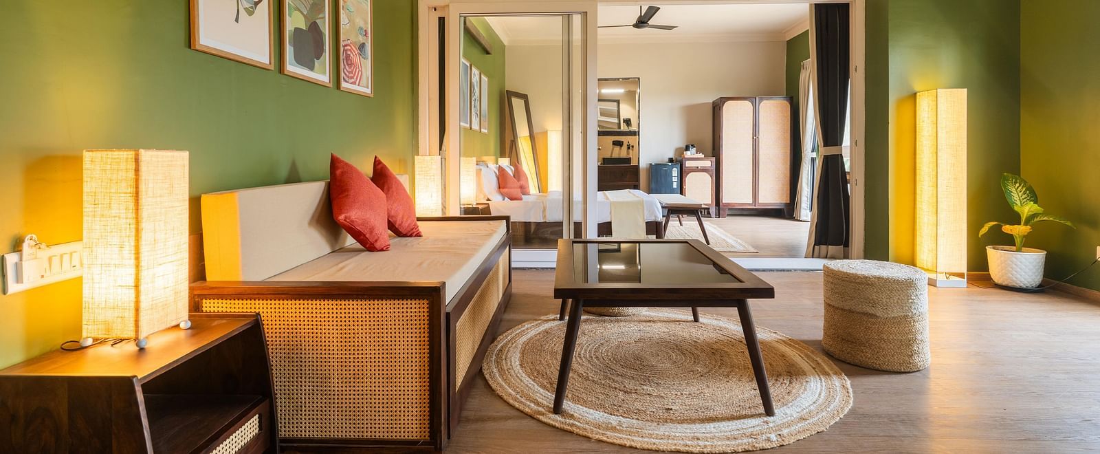 Open-plan suite with a cosy lounge, ambient lighting, and curated decor at Kssemya.