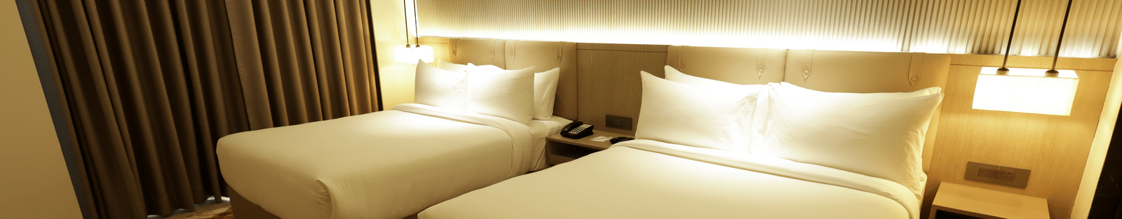 Room with soft lighting and warm tones for a relaxing stay at Ramada by Wyndham Sonipat Murthal