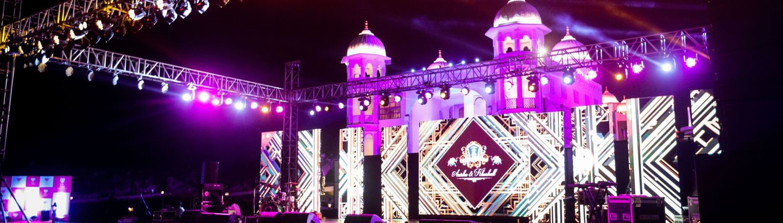 A view of the stage illuminated with neon lights featuring a digital screen - Kaldan Samudhra Palace