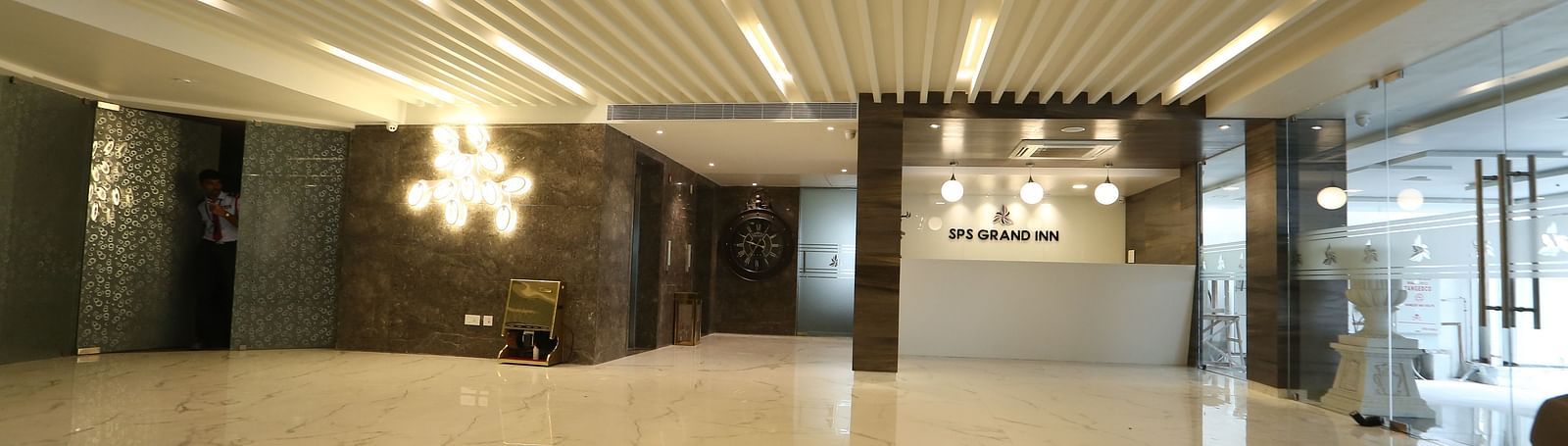 An expansive lobby or reception area featuring contemporary lighting and a polished floor - TGI SPS Grand, Coimbatore