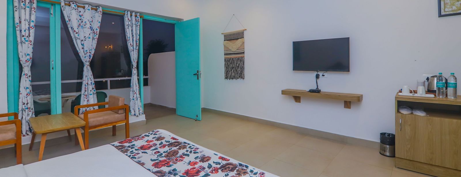 A large bedroom at Vedikant Resorts The Mallard Corbett includes a bed, seating area, and television.