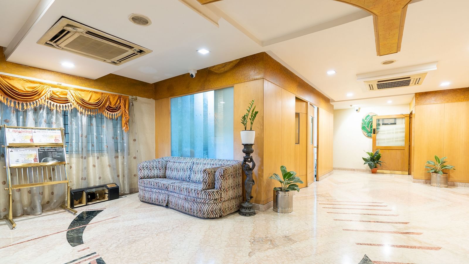 Overview of the lobby with seating arrangements - Hotel Pai Comforts, JP Nagar