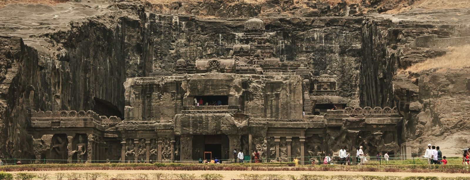 Caves carved into a hill during the day