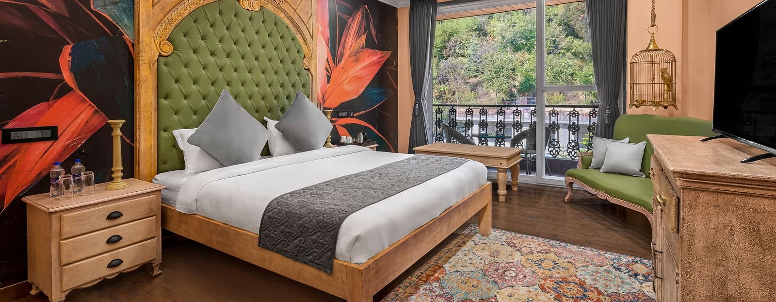 a bedroom with a wallpaper and a large green headrest and large windows leading out into the balcony - Atman, Dharamshala