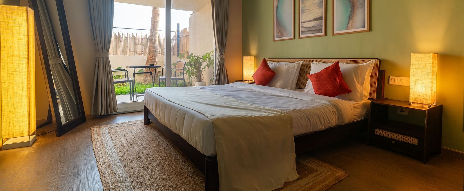 Bright and airy bedroom with double bed, contemporary decor, and access to balcony at Kssemya.