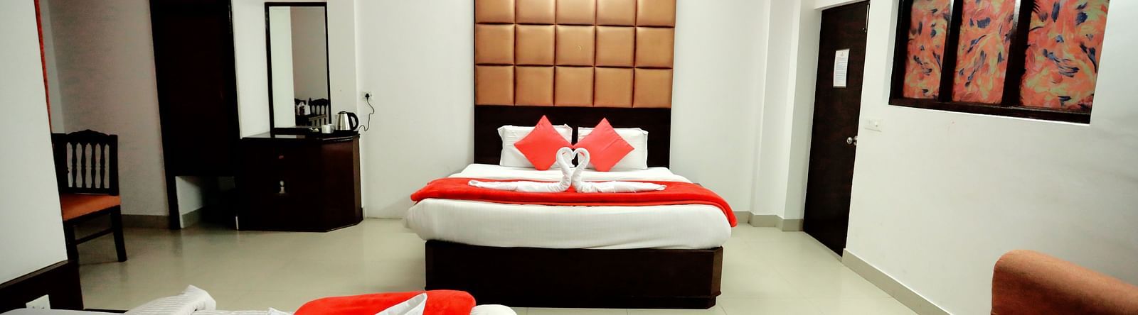 Image of a room with two beds and a sofa in the corner at Amara Hill Queen, Mussoorie 