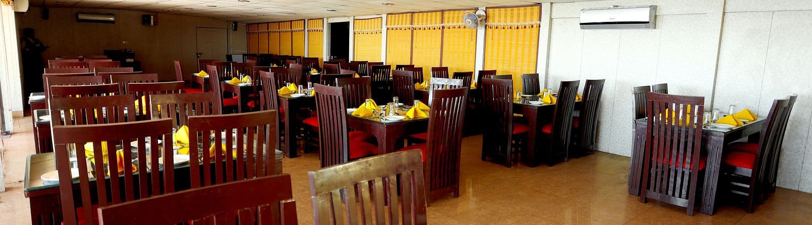 Image of a table with napkins arranged on the table at Amara Hill Queen, Mussoorie.