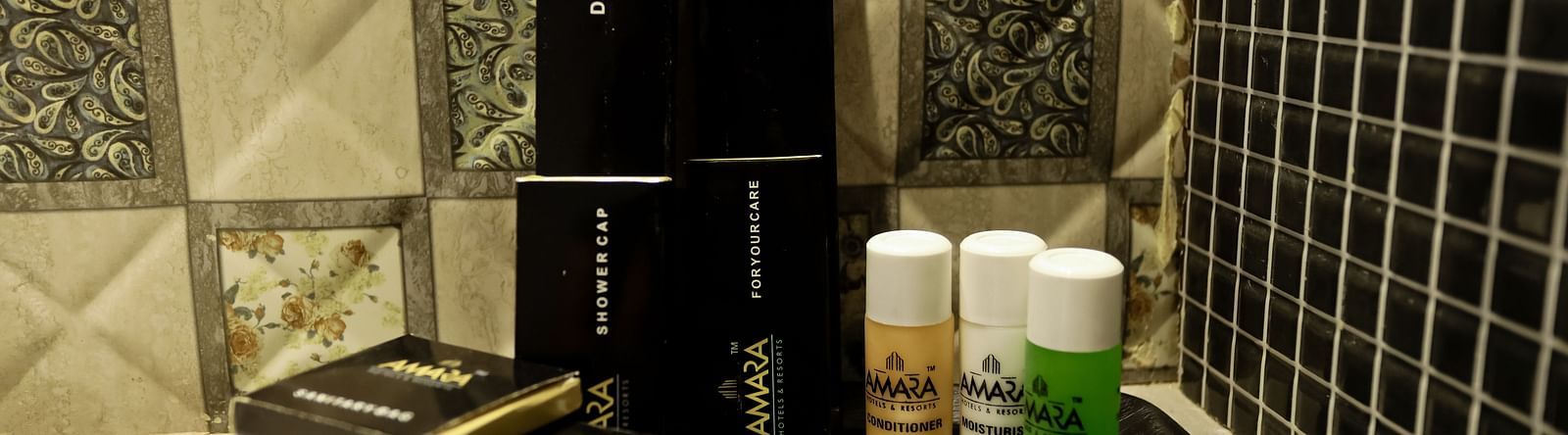 Image of toiletries placed on a flat surface at Calux Grand Baga. 