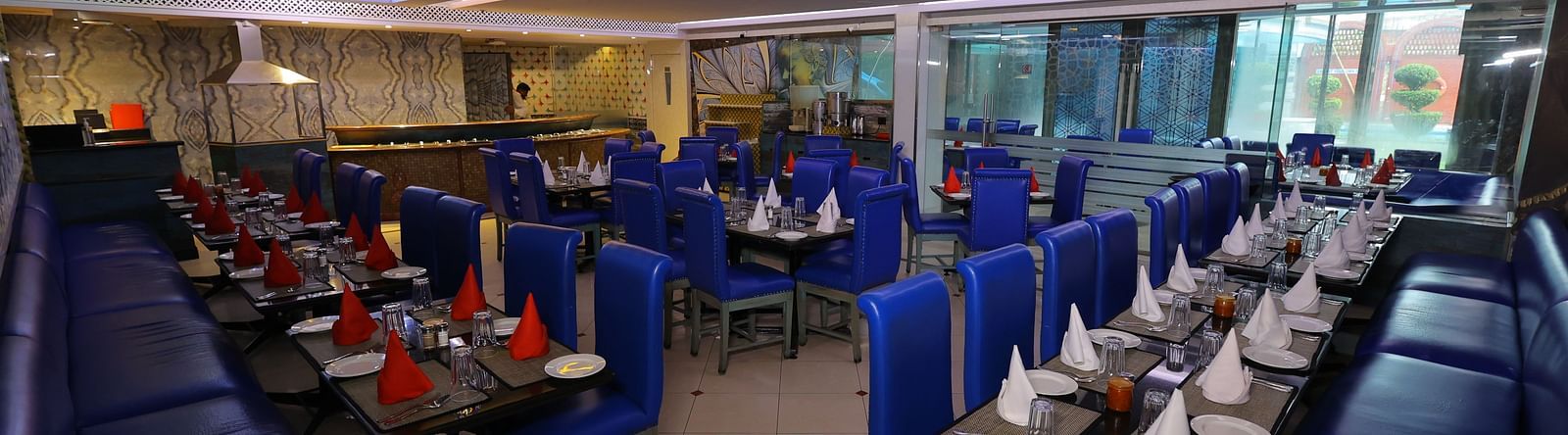Image of Noor Jahan buffet restaurant with seating arrangement chairs and tables