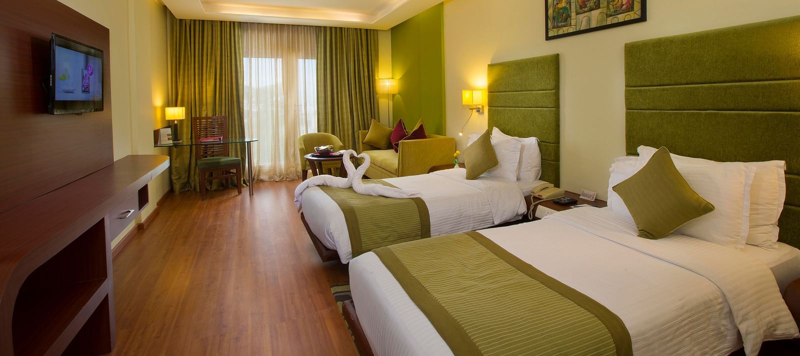 twin beds placed in Superior Room at Hotel Atithi - TGI Grand, Pondicherry