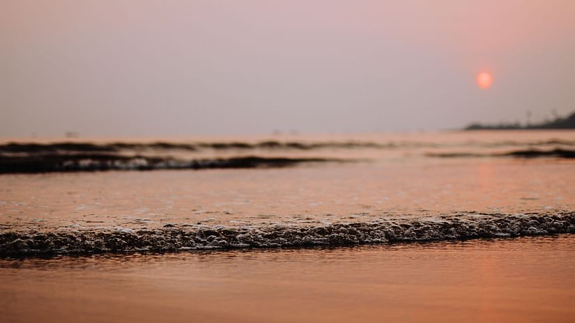 Beach with the sun in the background