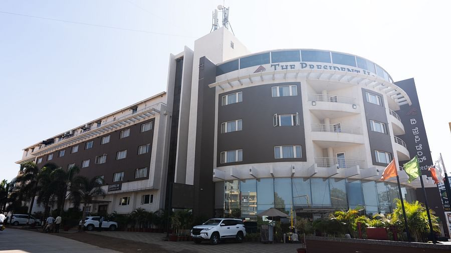 An image of a facade of The President Hotel, Hubli