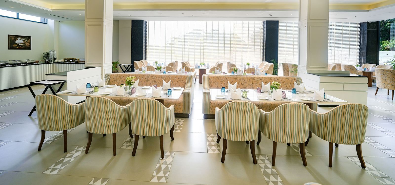 An image of our expansive restaurant in Bankhandi, featuring large dining tables, cosy furniture, and a buffet area - NAMAMI BY ZENQ BANKHANDI