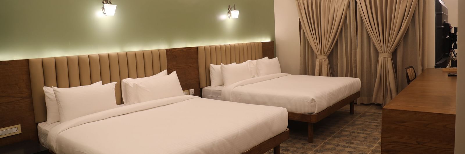 two double beds inside one of the Heritage Suites at Summer House, Nandi Hills