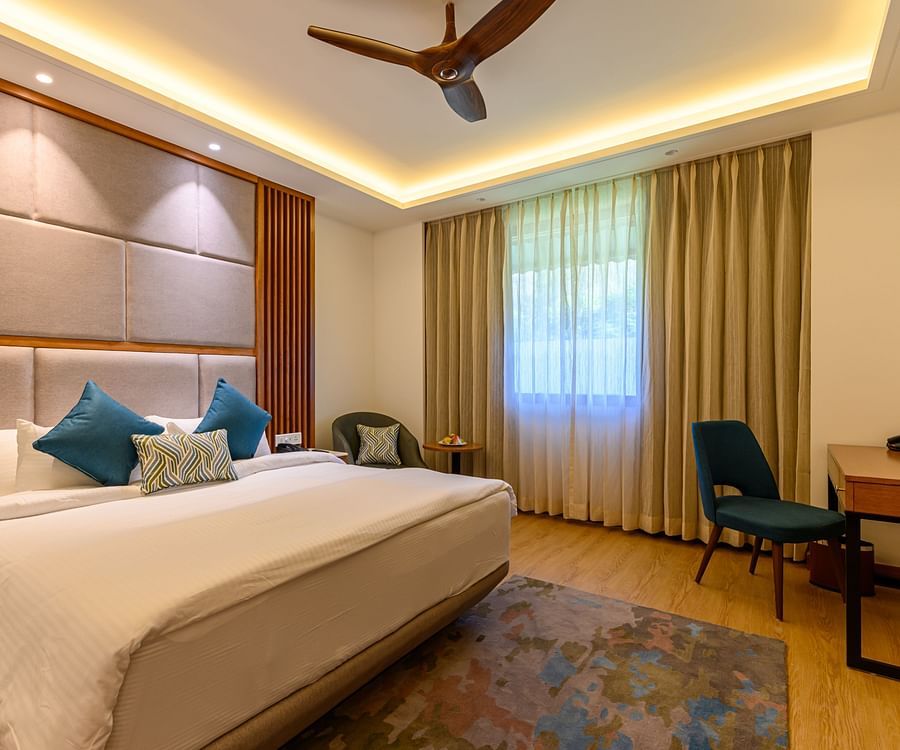 double bed and work desk and chair in one of our rooms