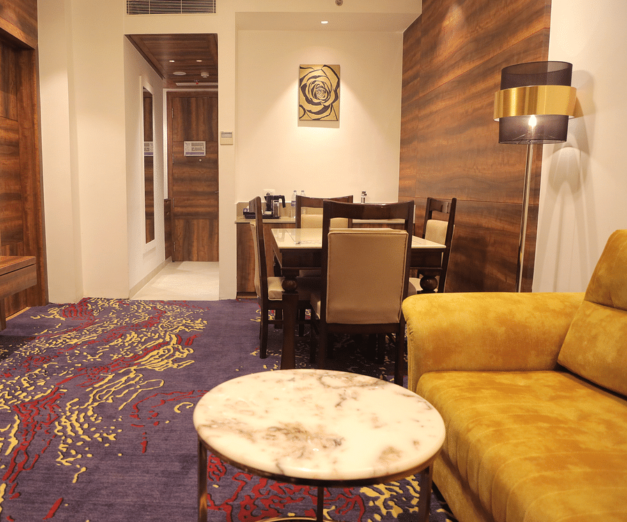 alt-text living room with a dining table and cushy sofa