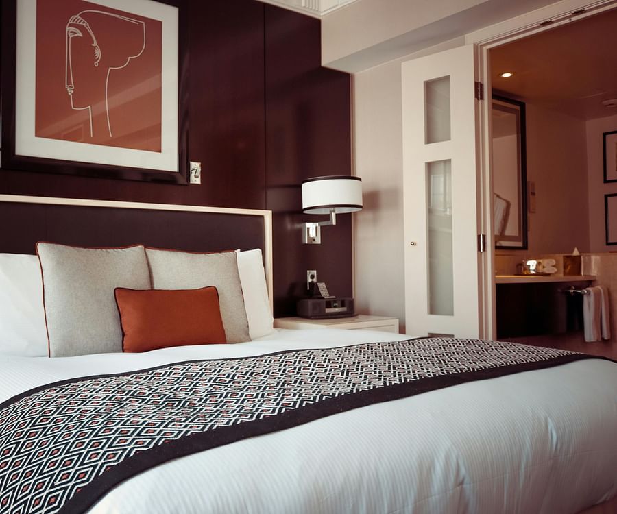 alt-text Spacious bed with neatly arranged pilllows