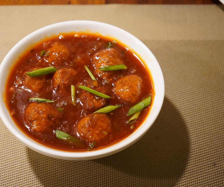 An image of a curry with vegetables and edible balls served in a bowl at Five Elements Hotel, Jodhpur