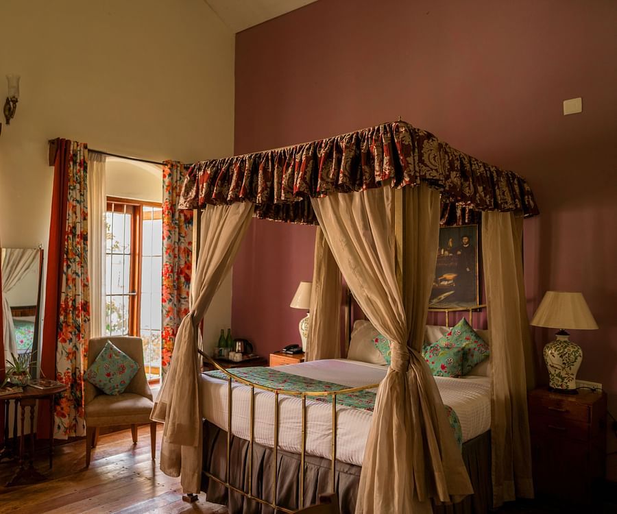 room with a king size bed and chairs at king's cliff