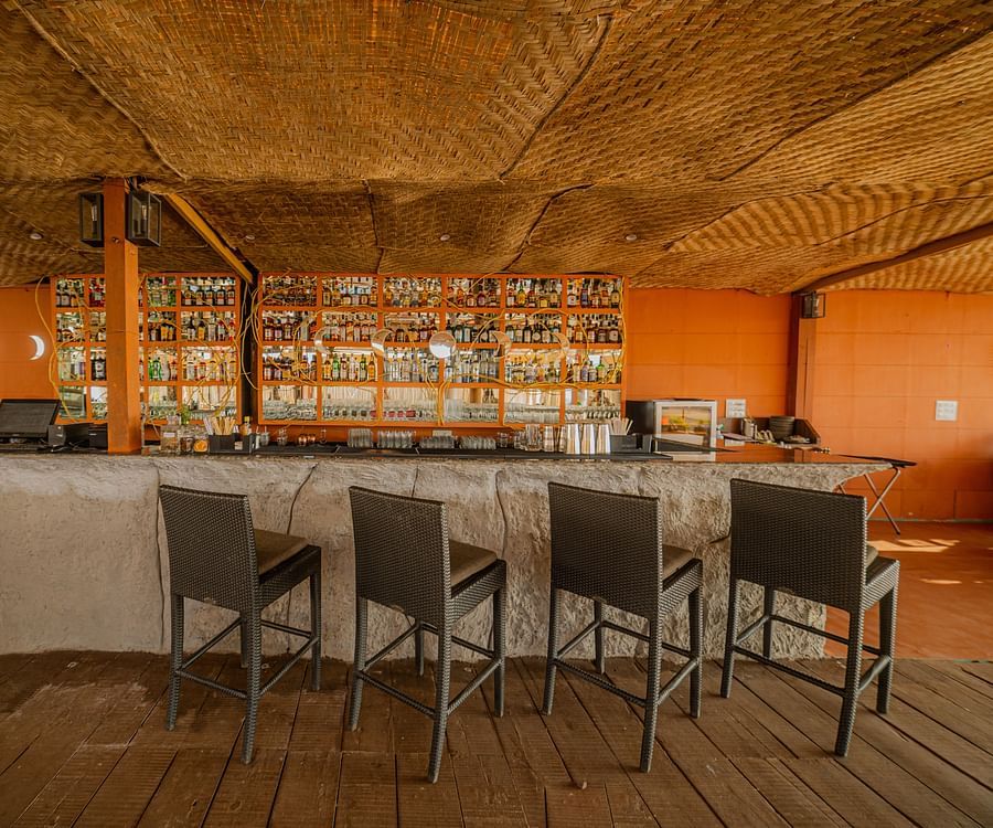alt-text image of a restaurant and bar designed with wooden interior with posh decor