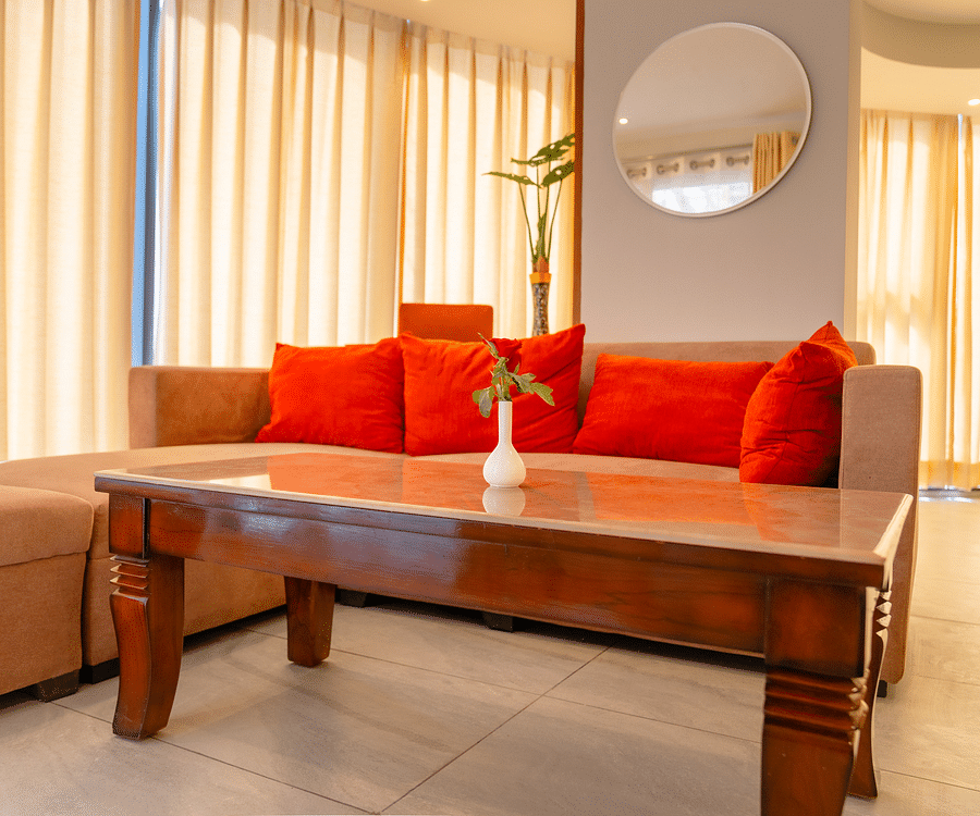 Living area with comfortable sofa of a Standard Room at Montclair Ananta, Elite.