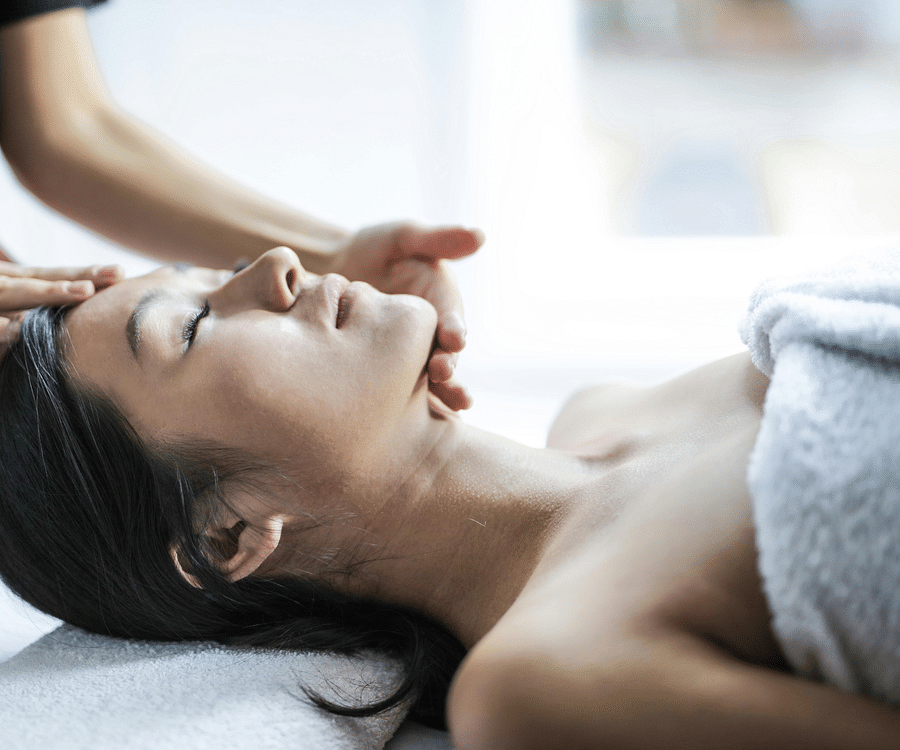 alt-text a shot of a woman taking facial massage