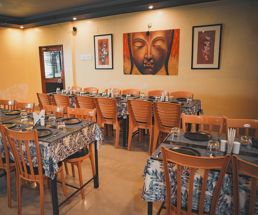 A dining space featuring neatly arranged tables and chairs