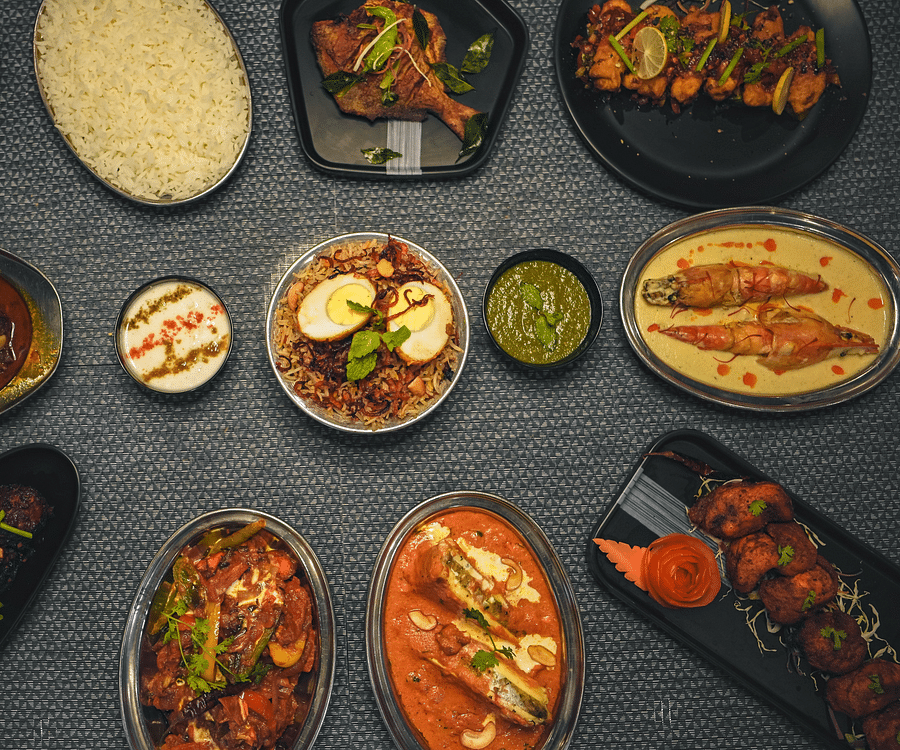 A table with a variety of different dishes arranged on separate plates