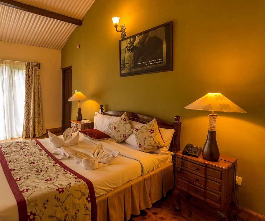 room with a cosy king size bed and warm interiors