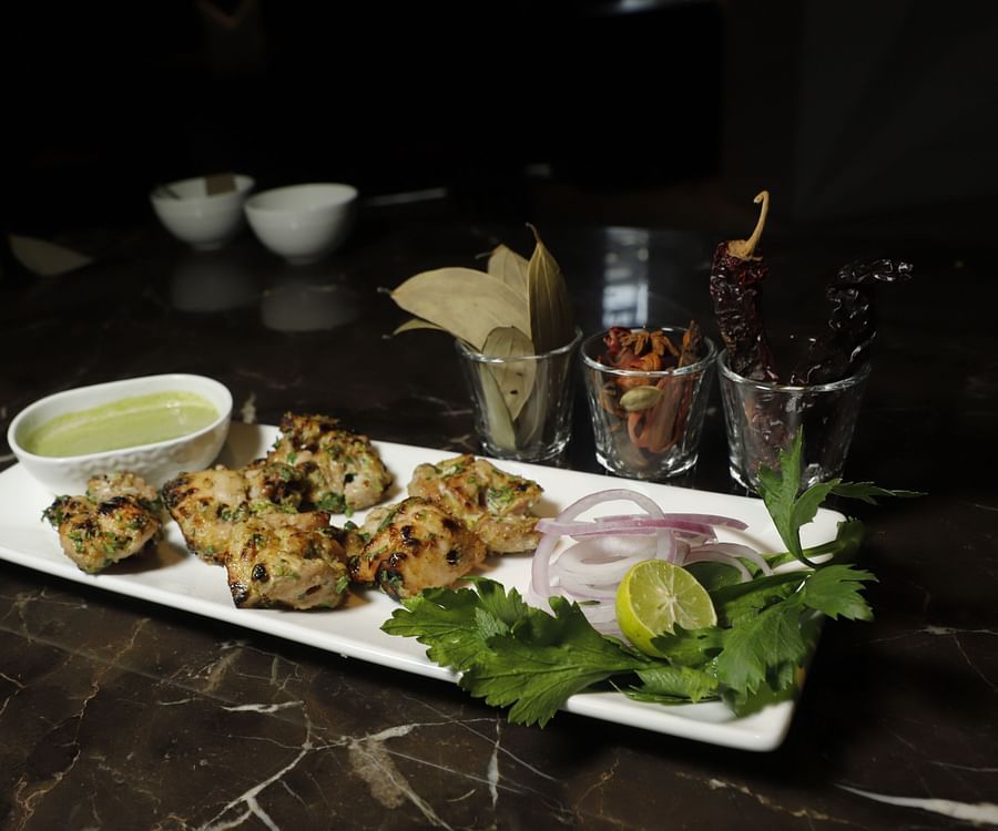 Udman By Ferns N Petals, Chattarpur - chicken malai tikka kebab at a restaurant table