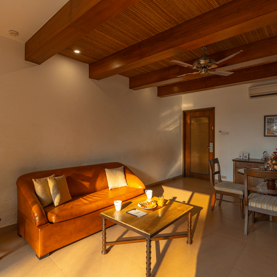 Seating area in suite rooms bathed in sunlight.
