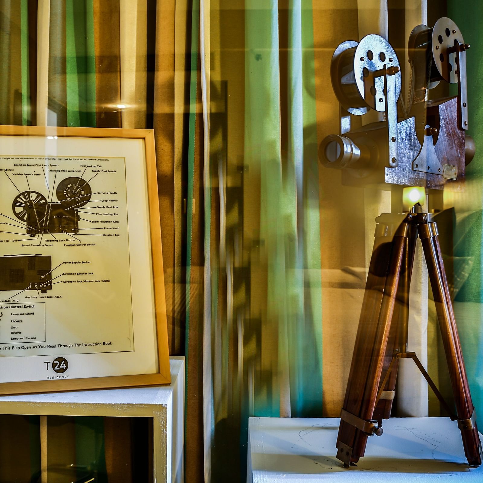 An old film video camera placed besides an illustration depicting its working at T24 Residency, Andheri East, Mumbai
