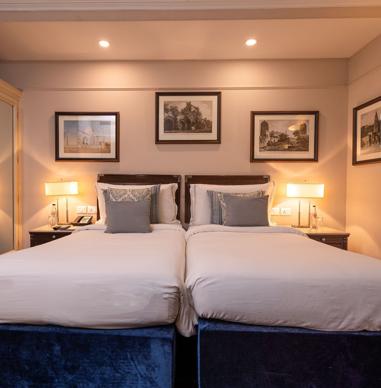Front view of the Superior Twin Bed Room at The Claridges New Delhi, highlighting twin beds with bedside lamps