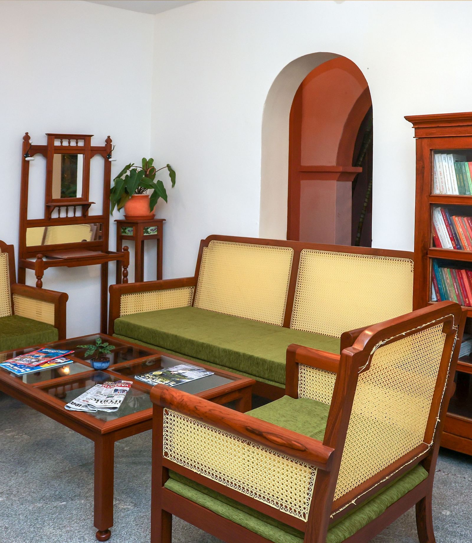 Sofas and a book shelf in the RECEPTION LOBBY at Mango Hill La Serene, Pondicherry