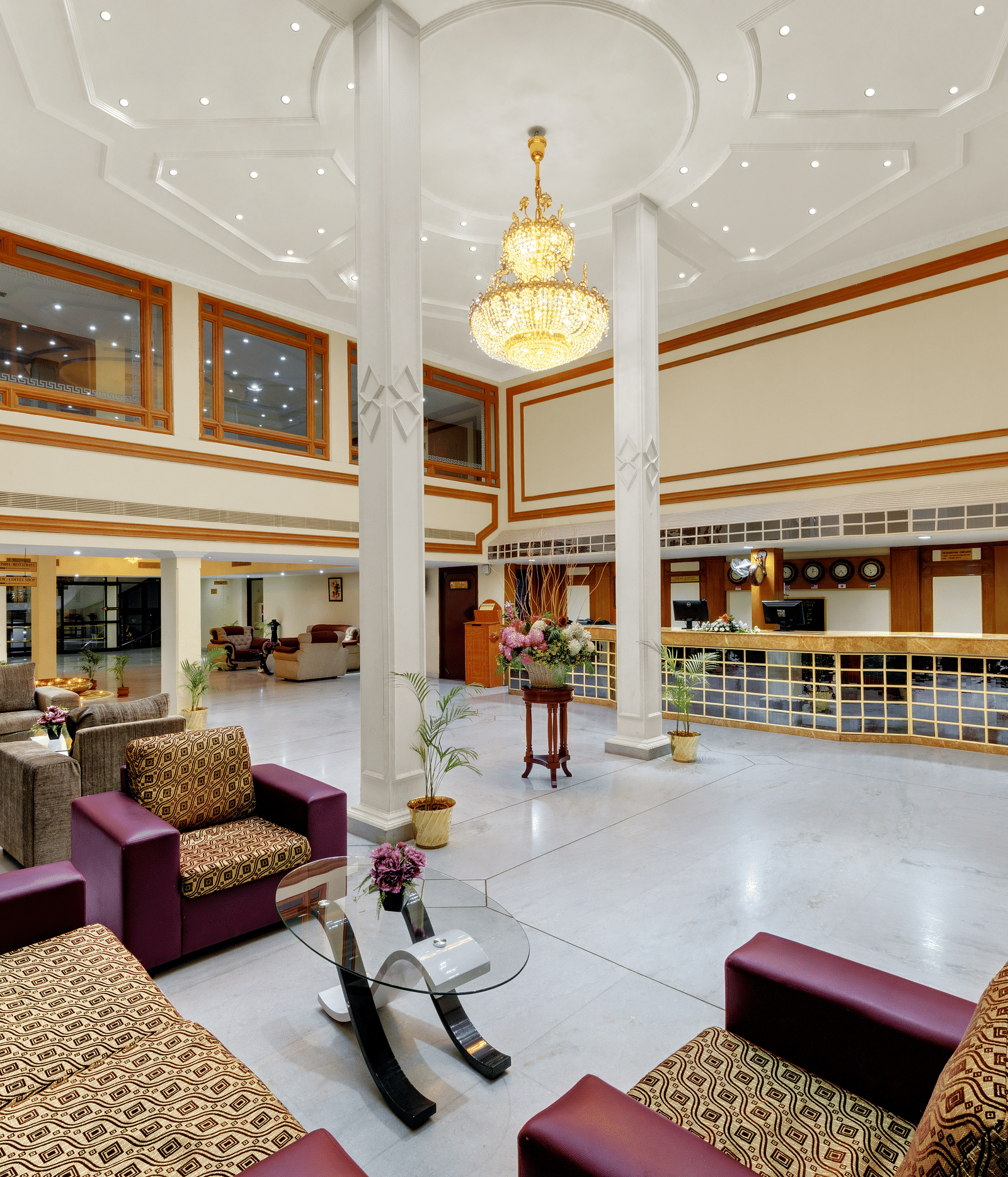 Waiting lounge with comfy sofa and table at SRM Hotel Maram Malai Nagar, Chennai