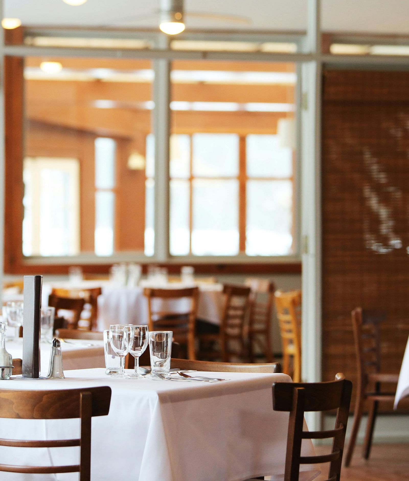 dining area with comfortable seating, culinary delights neatly arranged on the table, and a warm, inviting ambience