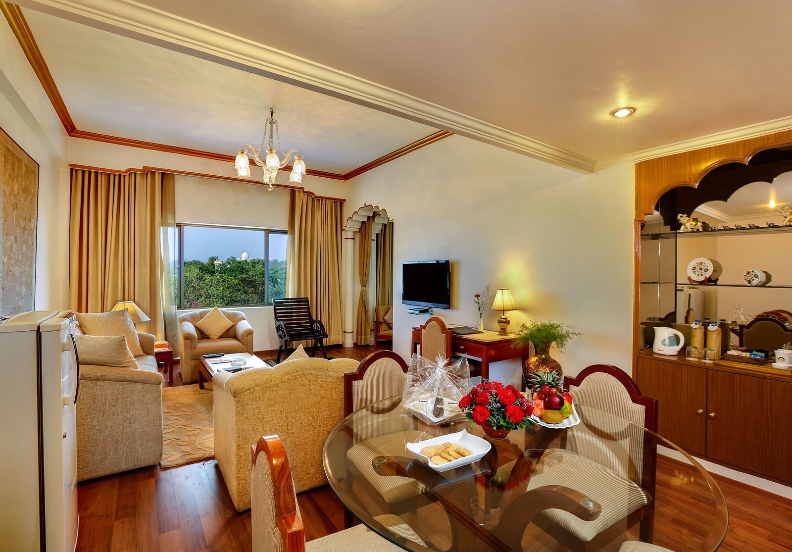 The Mumtaz Suite living area with a sofa and a dining table