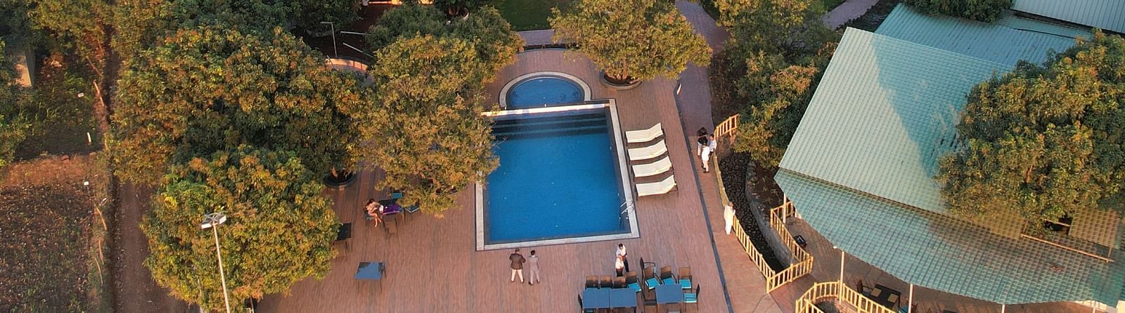 Overhead view of the facade of Mango Leaf Lake Resort, Pune